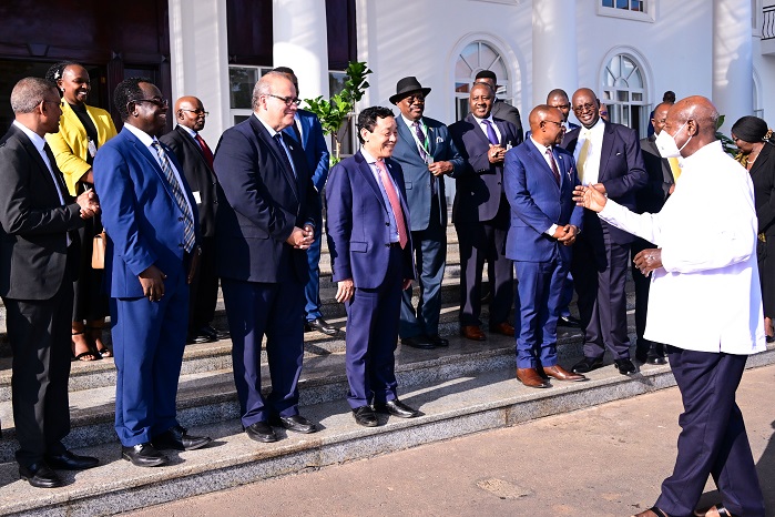 President Museveni interacts with Food and Agriculture Organisation (FAO) Director General Qu Dongyu (C) and his delegation (L) after a meeting
