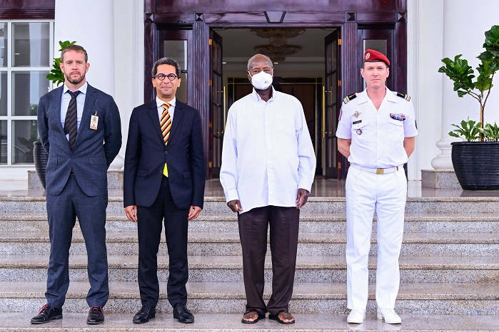 President Museveni poses for a photo with outgoing French Ambassador to Uganda Xavier Sticker (2nd L) after a meeting at State House Entebbe on