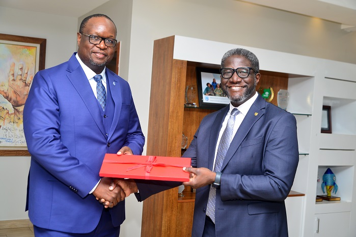 Stanbic's Chief Execuitive Mumba Kenneth Kalifungwa (L) and Sam Mwogeza, the bank's Executive Director (1)