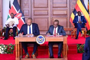 Uganda Investment Authorityu's Director General Robert Mukiza and his Kenyan counterpart signing an MOU on Investment promotions at Nairobi Stat