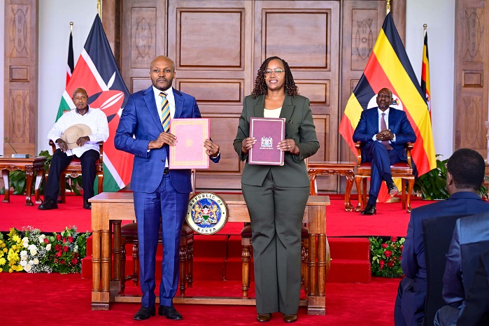 Uganda National Bureau of Standards (UNBS) Executive Director Eng James Kasigwa and his Kenyan counterpart after signing an MOU on quality and s