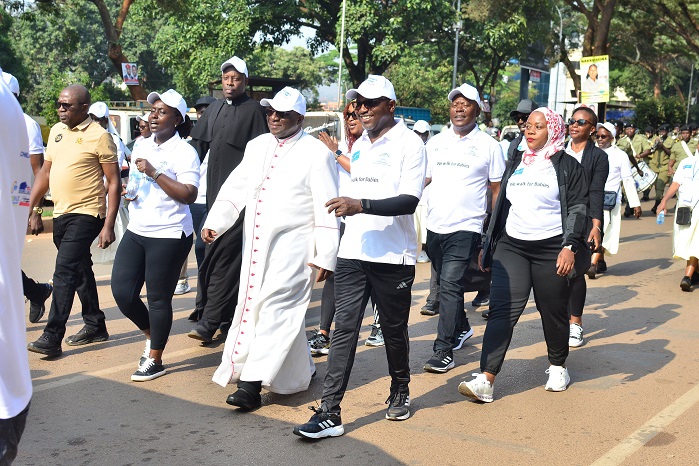 The Archbishop of Kampala Archdiocese, Rev Paul Ssemwogerere, Centenary Bank Managing Director Fabian Kasi and other officials during the Nsamby