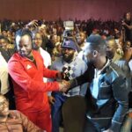 Bobby Wne and Bebe Cool shake hands