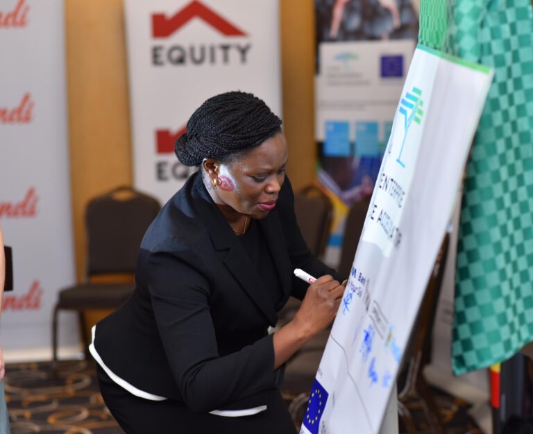 Catherine Psomgen, Director Public Sector and Social Investment, sign a commitment on behalf of the bank at the launch of the second phase of UGEFA green financing, last week.
