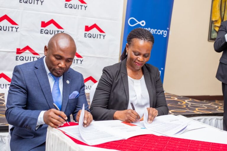 Equity Bank Director of Public Sector and Social Investment, Catherine Psomgen signing the MoU, with Water.org Africa Regional Director Francis Musinguzi at Protea Hotel yesterday. The partnership wi(3)