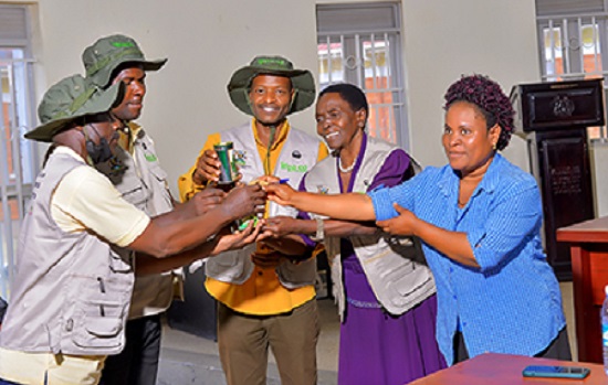 ECOTRUST Local government officials handing over vegetable seedlings to model farmers.